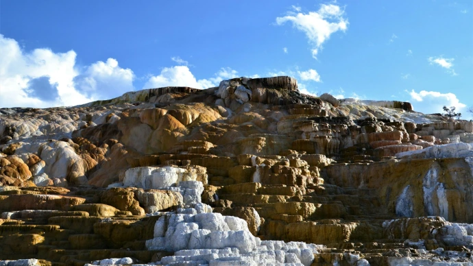 brown rock formation under blue sky during daytime